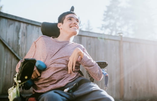 Man in wheelchair on a sunny day